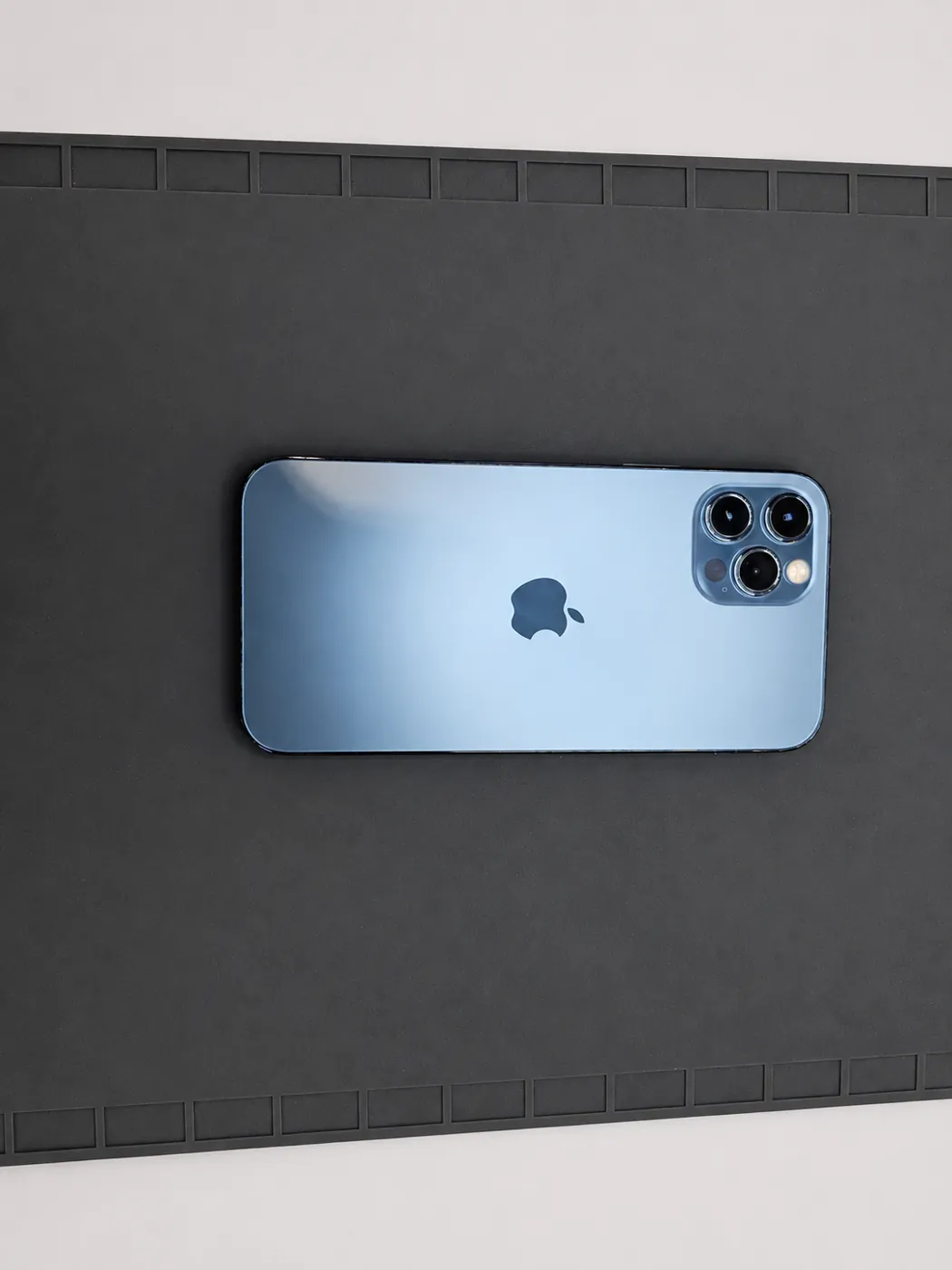 The same blue iPhone 12 Pro after back glass replacement, with a clean matching rear panel